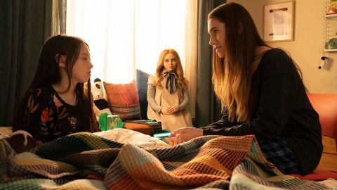 Cady (Violet McGraw, left), M3GAN and Gemma (Allison Williams) in a scene from 