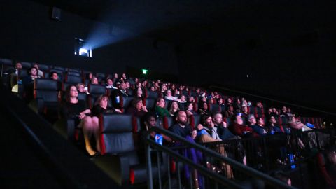 Attendees watch the premiere of Passionflix's 